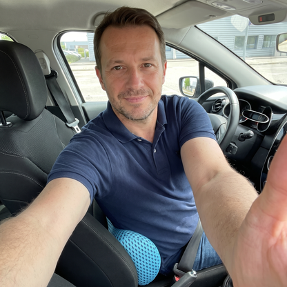 Customer using the lumbar cushion in his car